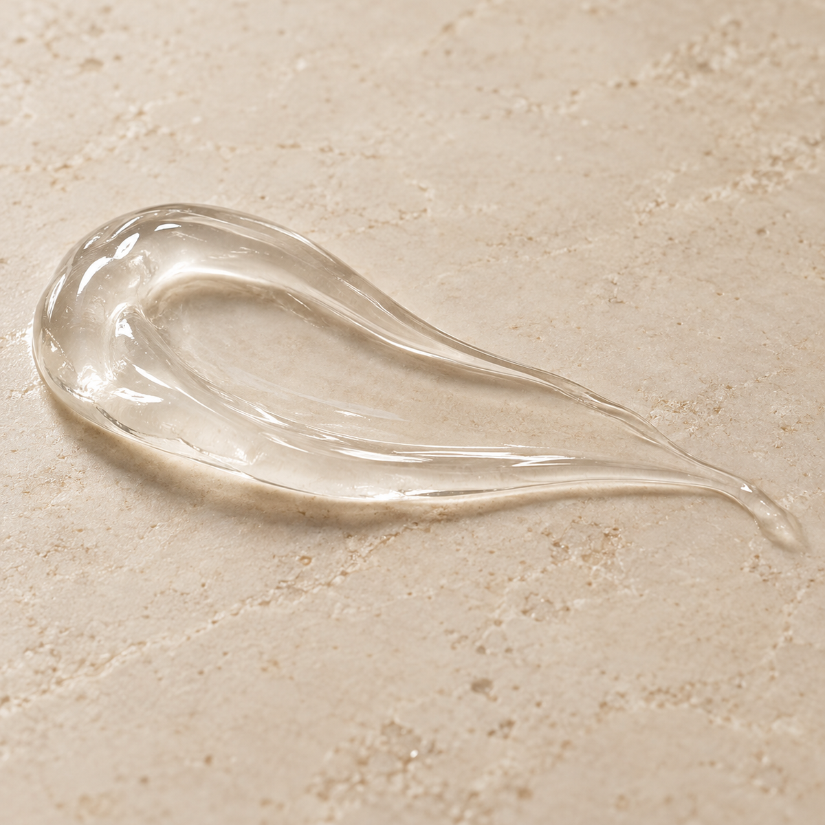 Textura transparente del gel líquido sobre piedra clara